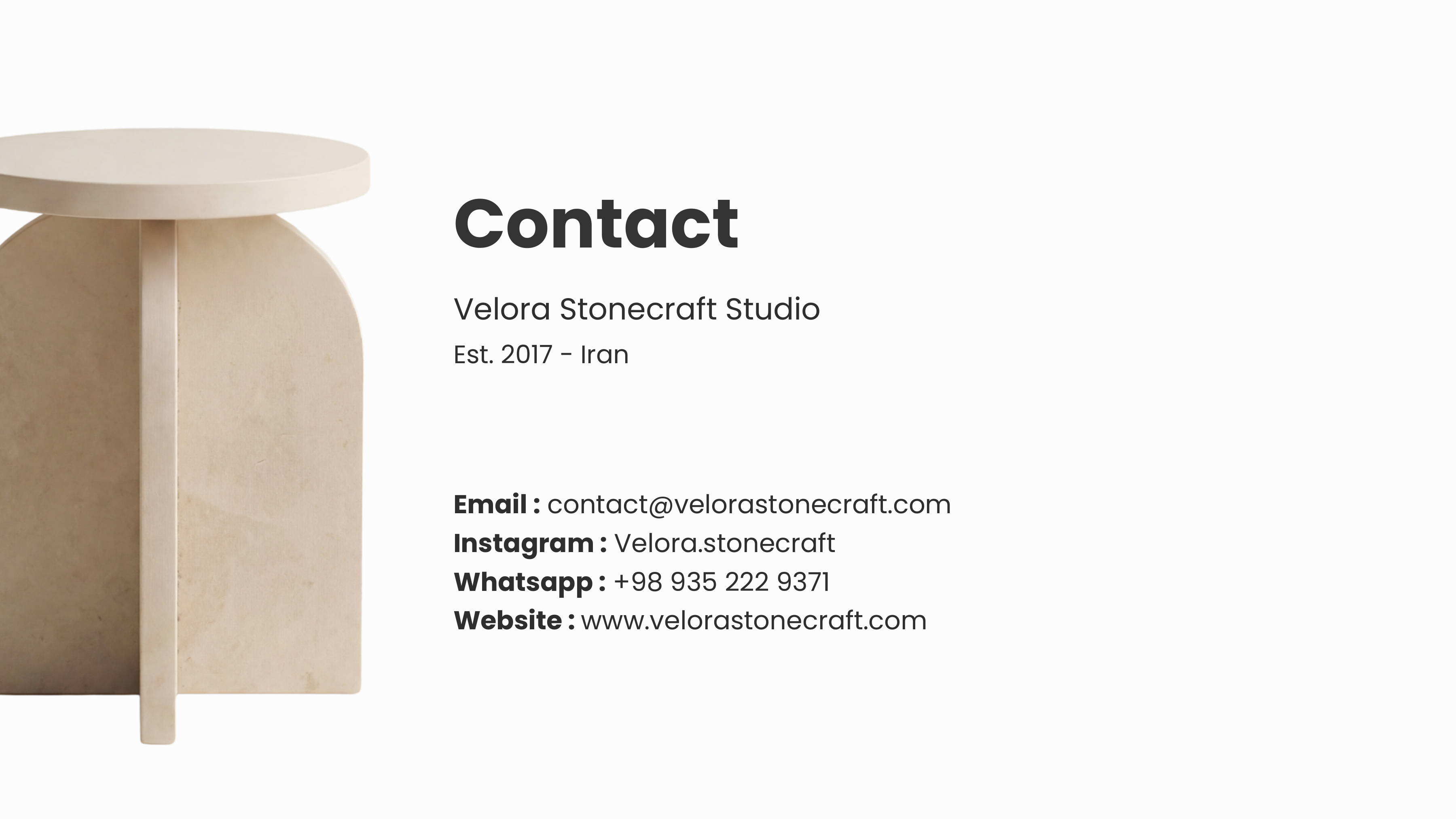 Contact page — Velora Stonecraft Studio details with a stone side table